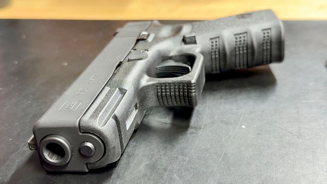 Pro-2A rally in Massachusetts with American flags and Don't Tread on Me signs