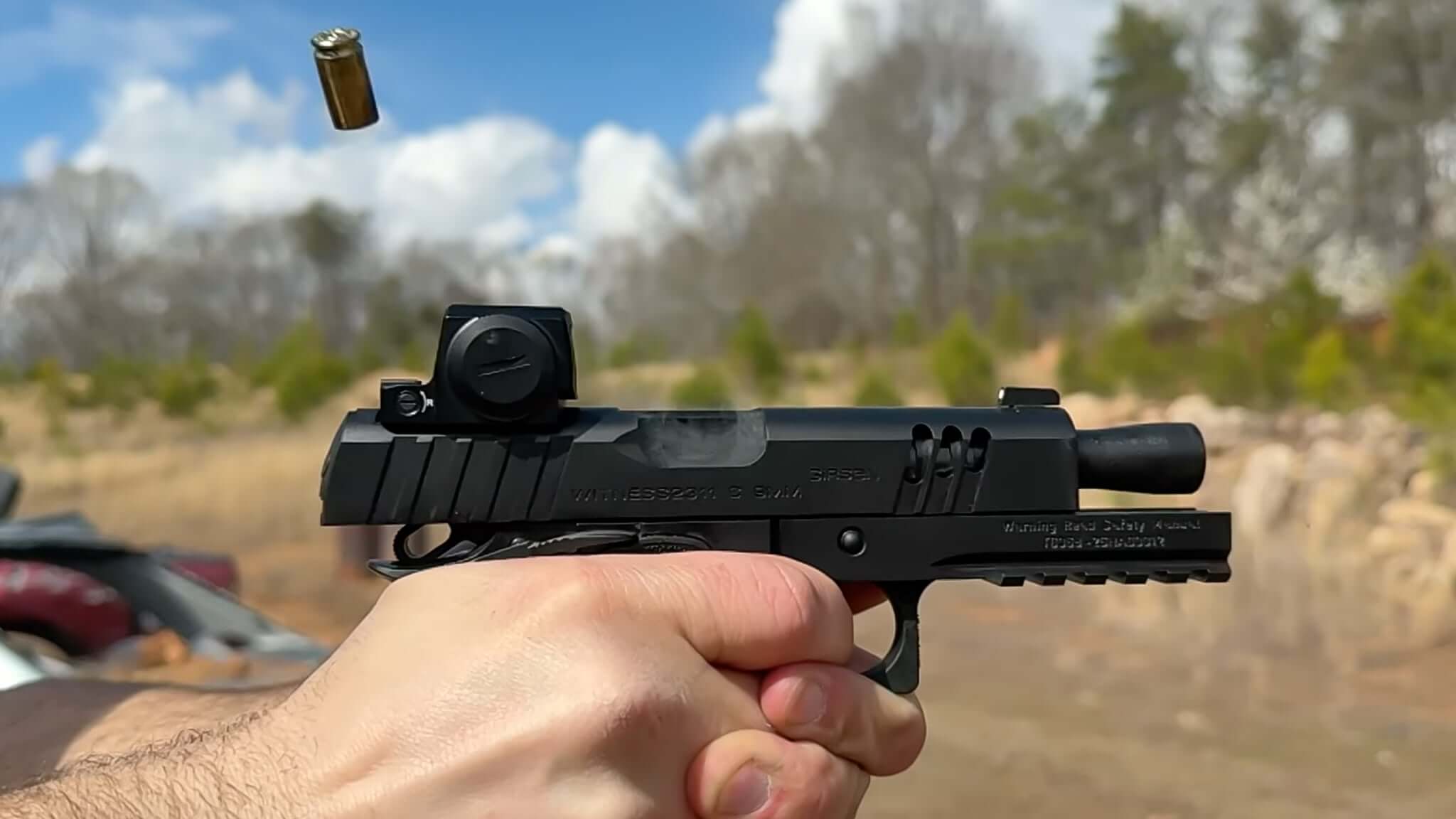 Close-up of Girsan Witness2311 CMX grip module, optic cut, accessory rail, and extended beavertail, emphasizing the slim profile and high-capacity magazine.