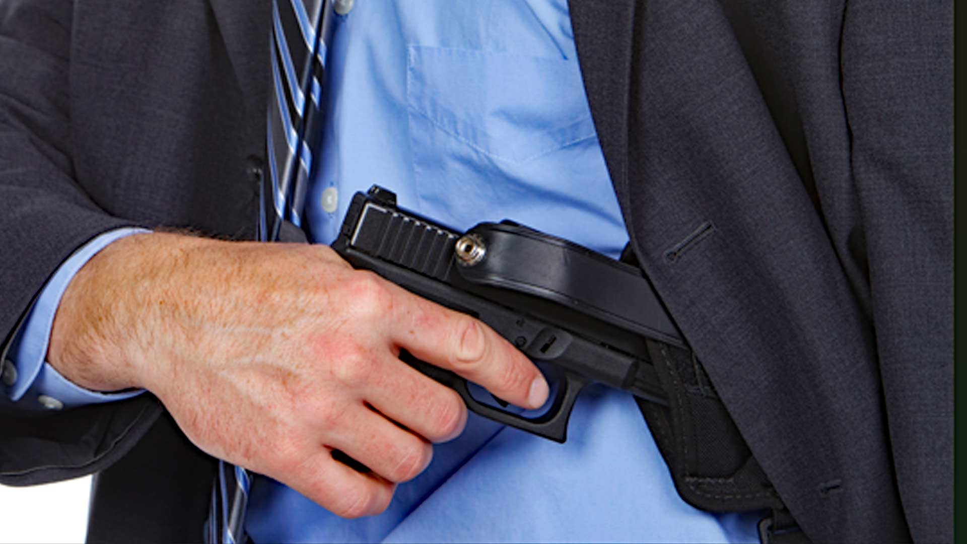 Group of teachers in tactical training drill, practicing concealed draw and engagement at a school shooting simulation