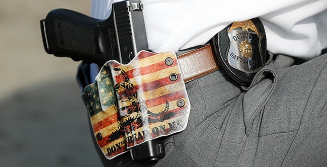 New Jersey appellate court gavel striking balance between cannabis leaf and police firearm, symbolizing the double standard in gun laws.