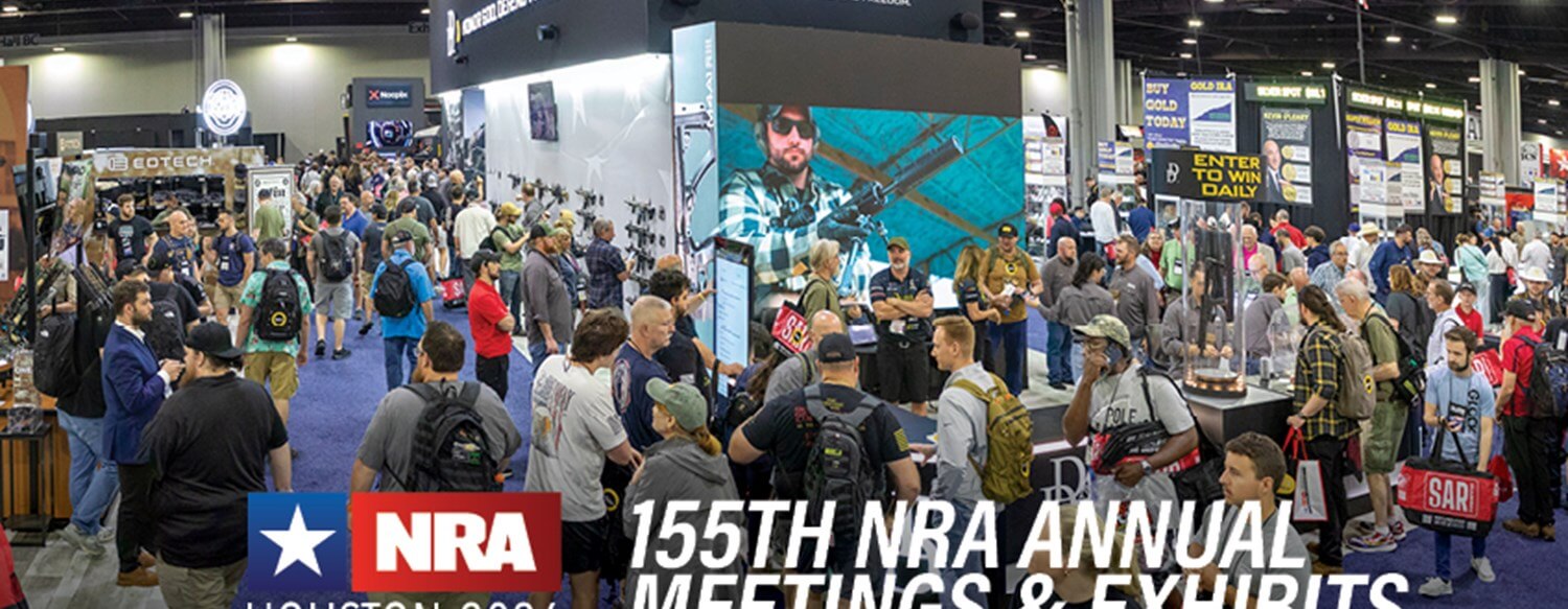 Booths packed with new firearms, suppressors, optics, and accessories at the NRA 2026 Exhibits in Houston.