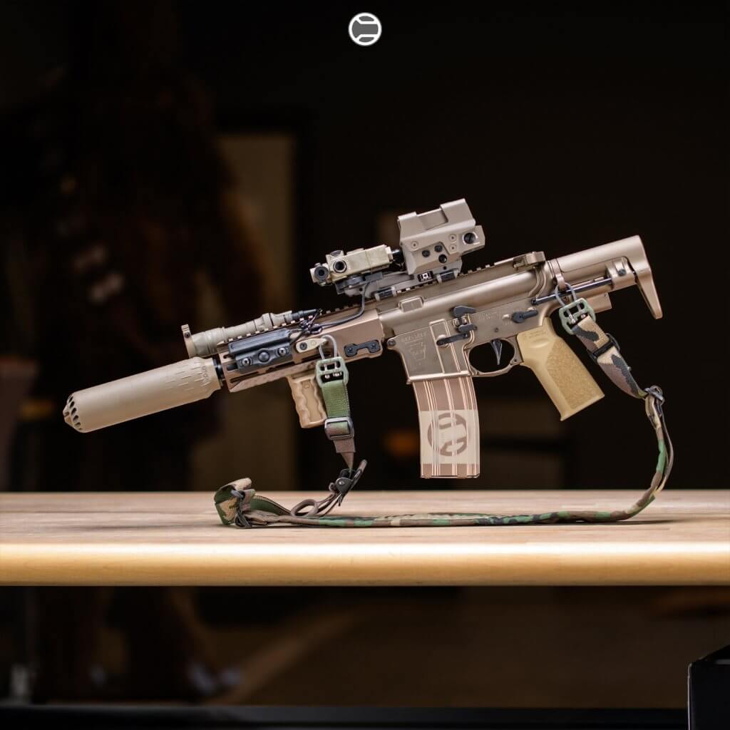 Close-up of the new RailScales AR-15 handguard showing lightweight construction, multiple mounting slots, and integrated QD sling points