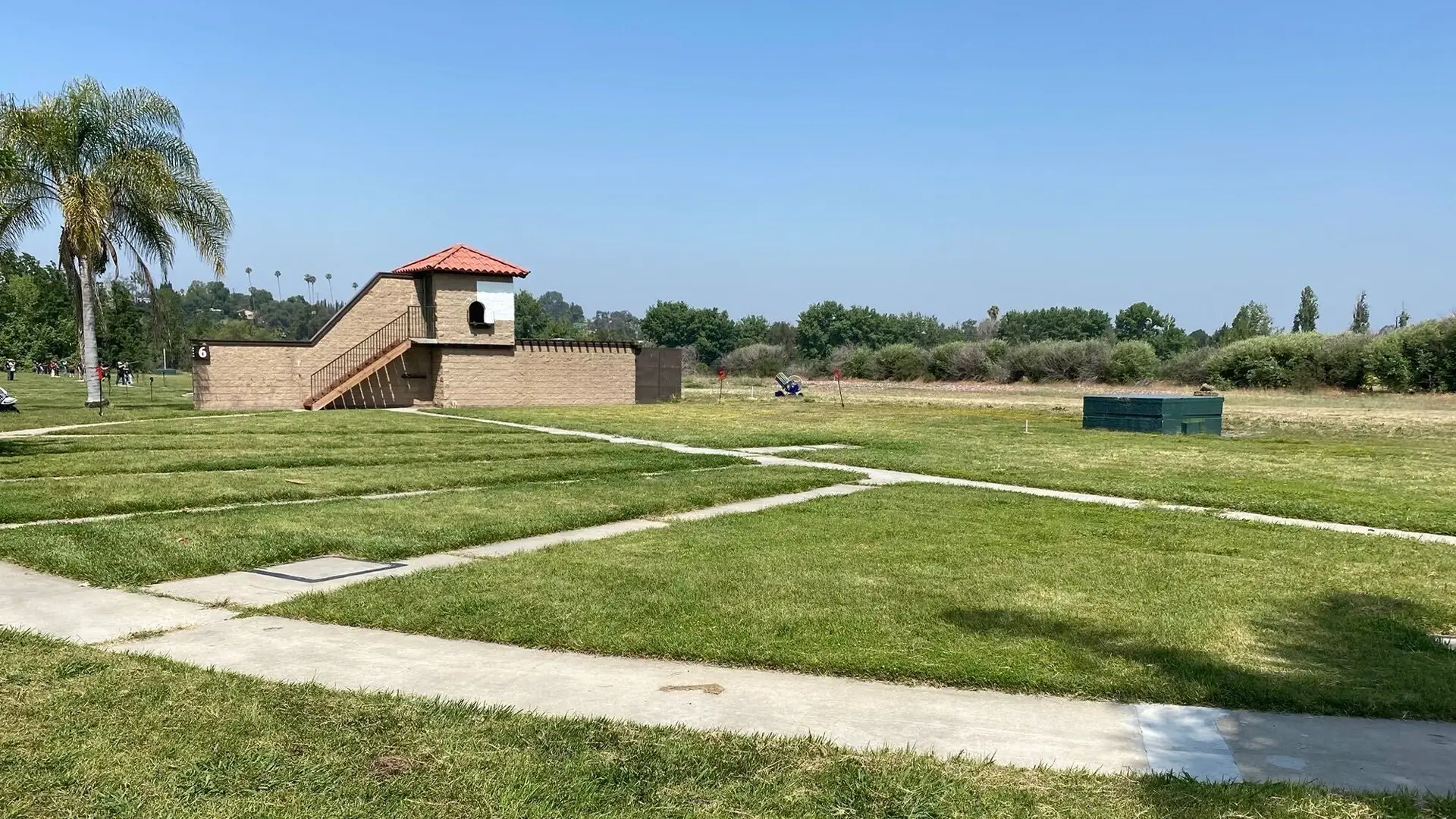 Aerial view of Whittier Narrows Clay Shooting Center with trap and skeet fields ready for Olympic shotgun events, surrounded by scenic Southern California hills.