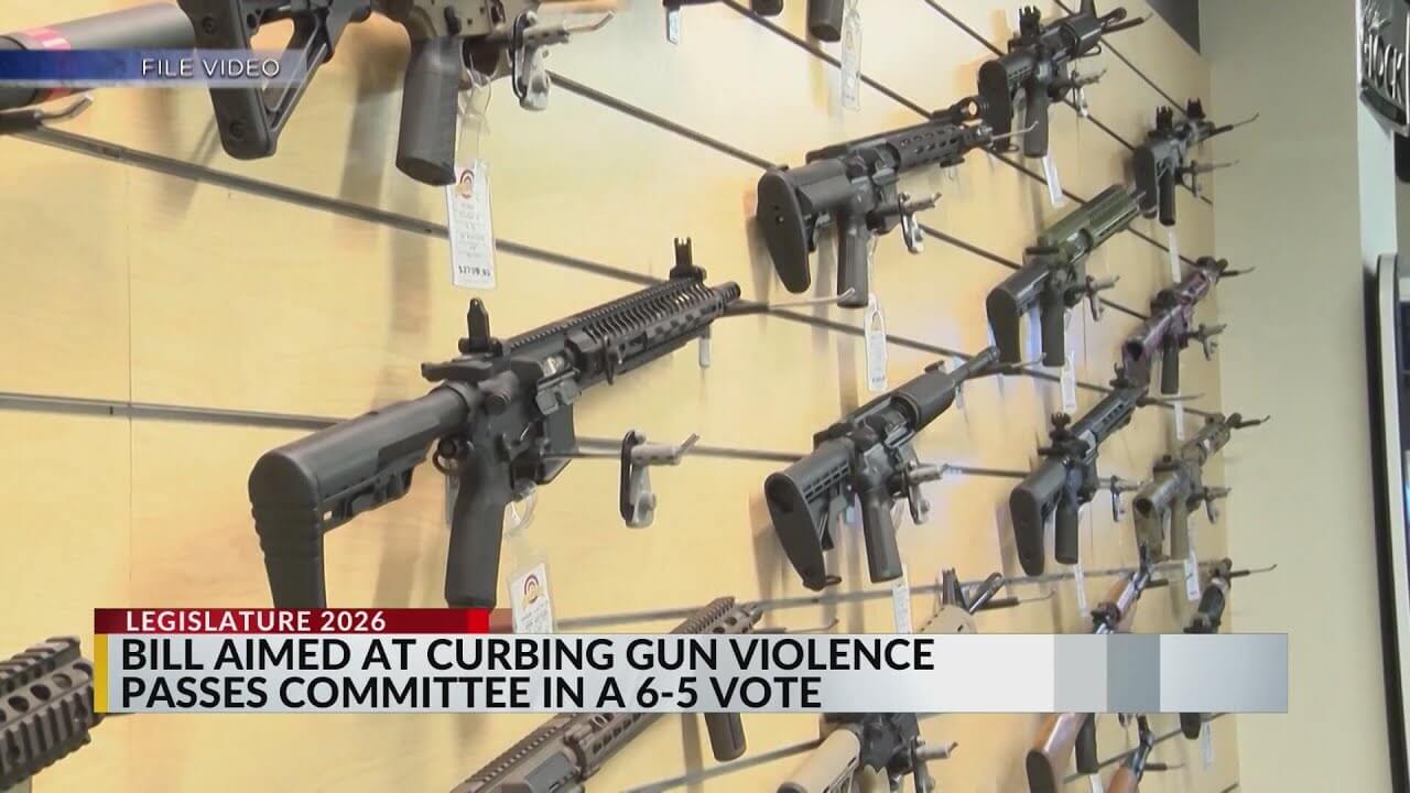 Pro-Second Amendment protesters outside the New Mexico state capitol holding signs against gun control and chanting for constitutional rights.