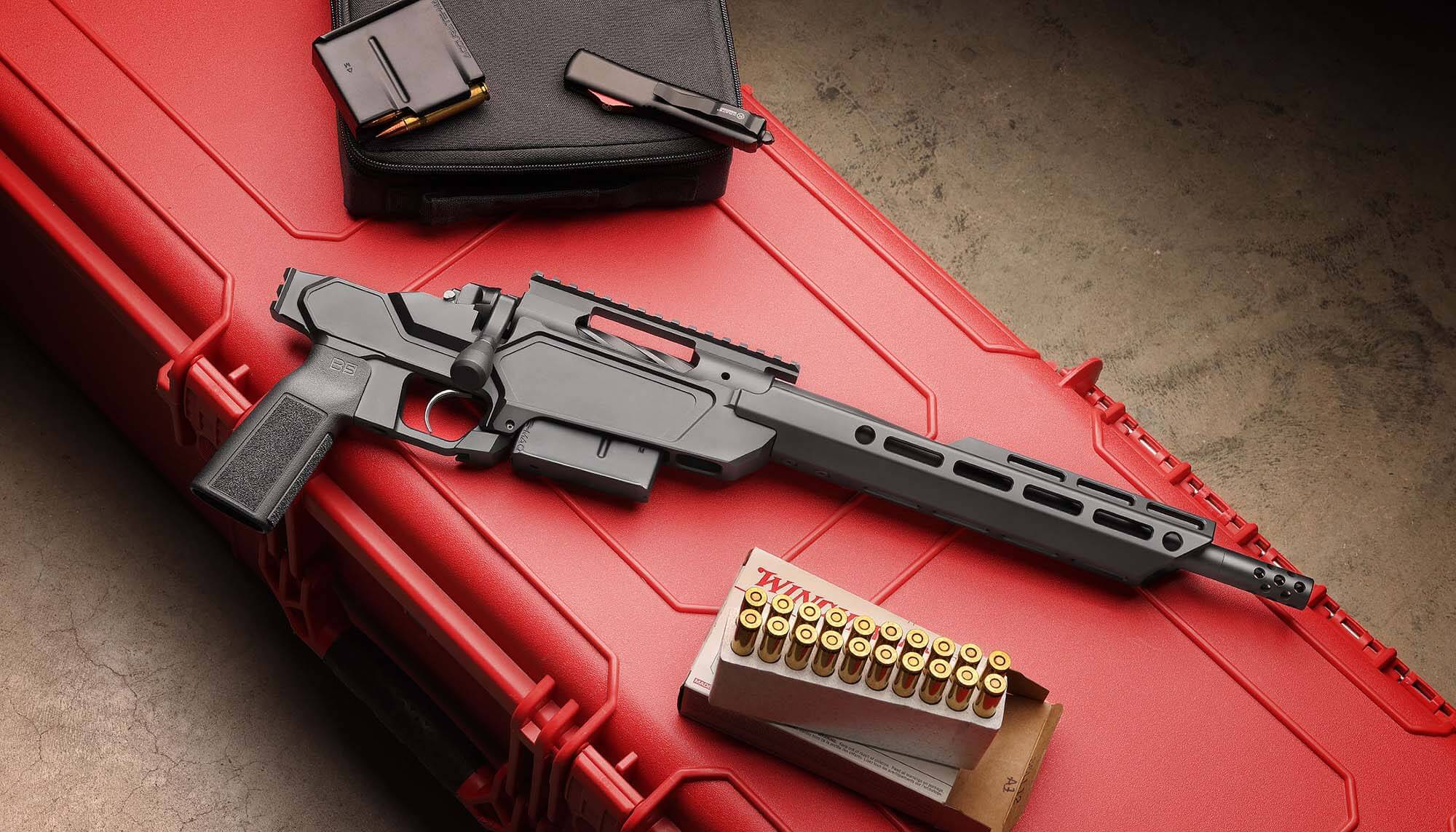 Close-up of the Model 2020 Heatseeker Pistol's adjustable carbon fiber cheek riser, M-LOK slots, and AR-15 compatible controls