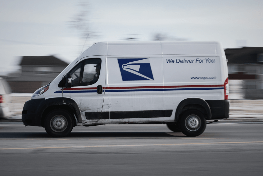 USPS mail truck delivering a secure package containing an unloaded handgun to a law-abiding citizen's doorstep in a suburban neighborhood, symbolizing restored Second Amendment rights