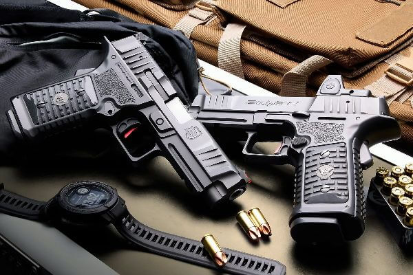 BULWARK pistol on shooting range table after 5,000-round endurance test, magazines loaded nearby.